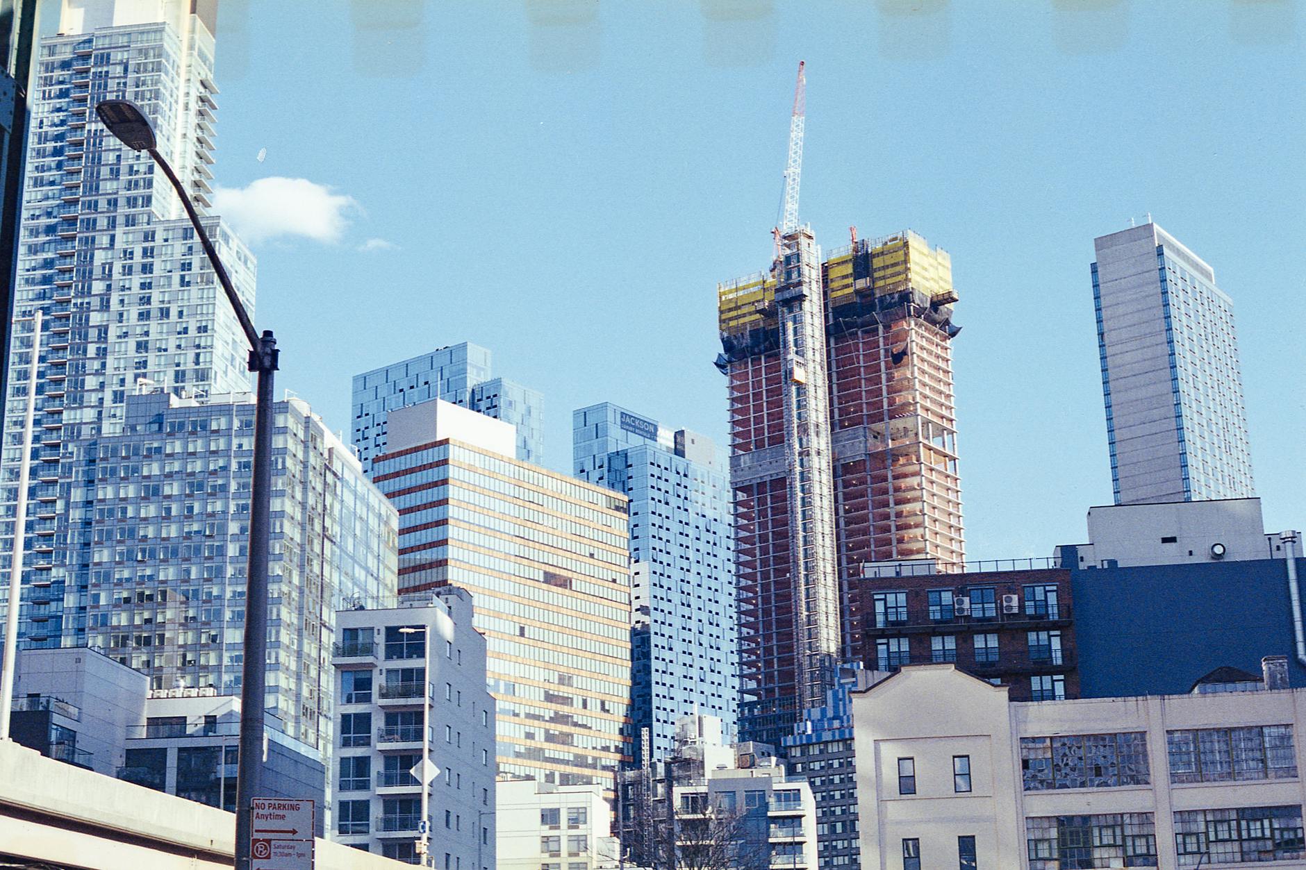 view of skyscrapers in new york city under blue sky